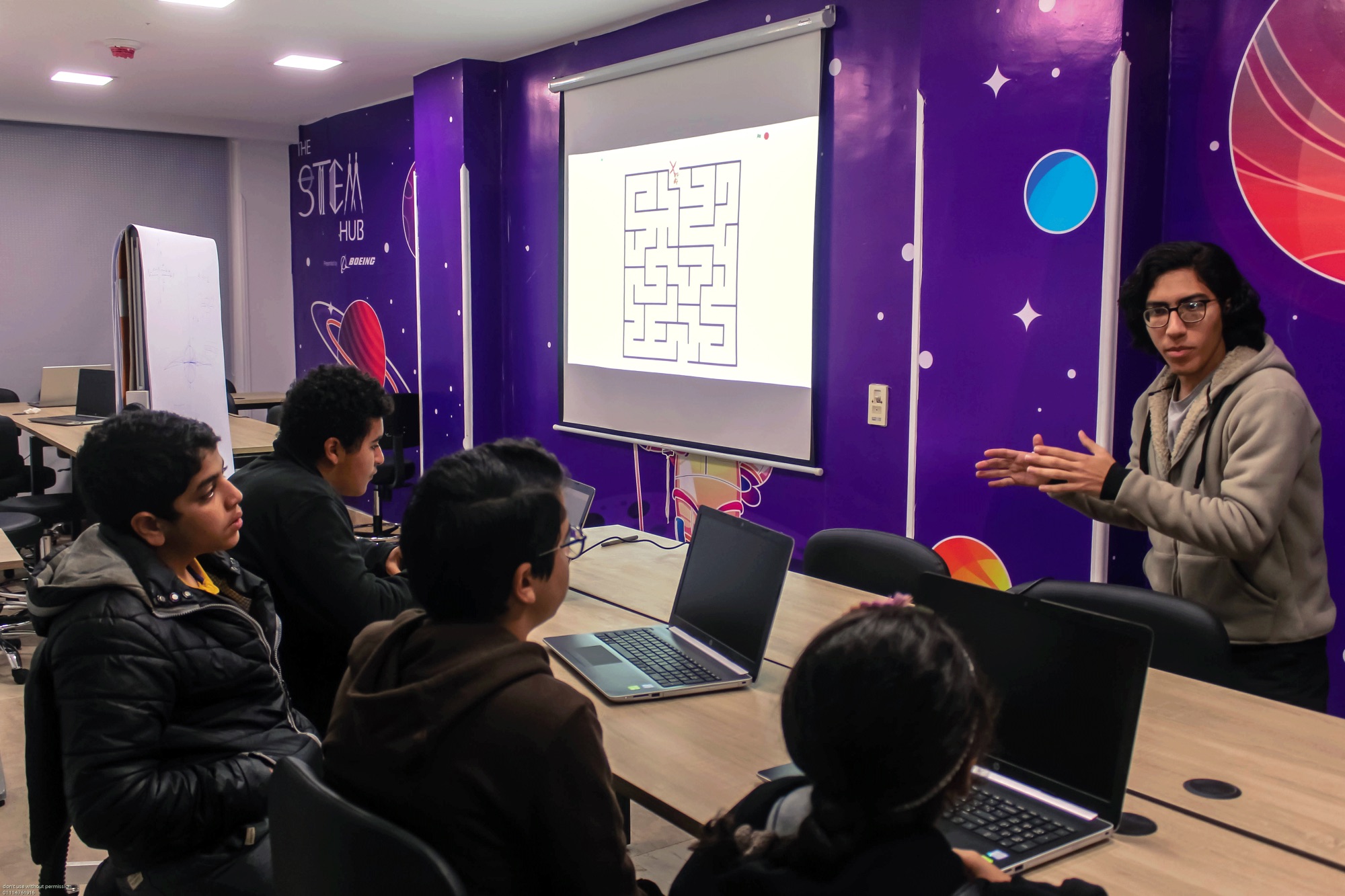 Teaching a programming session to students at The STEM Hub.