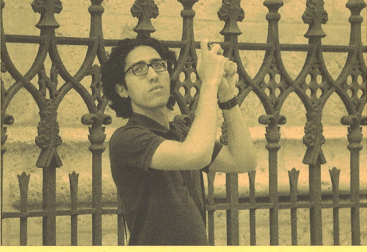 Bassam, mid-trip, at a gate in Granada.
